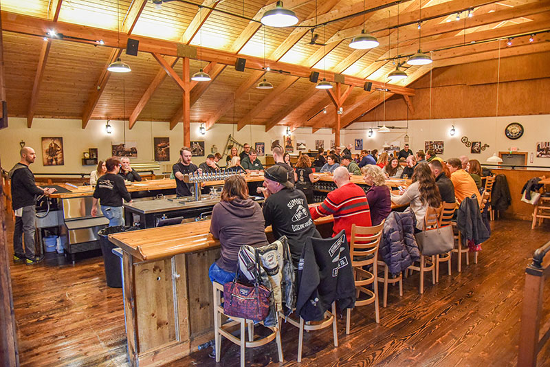 Interior of Breaker Brewing Outpost, a cozy and inviting space for craft beer enthusiasts to enjoy unique brews and good company